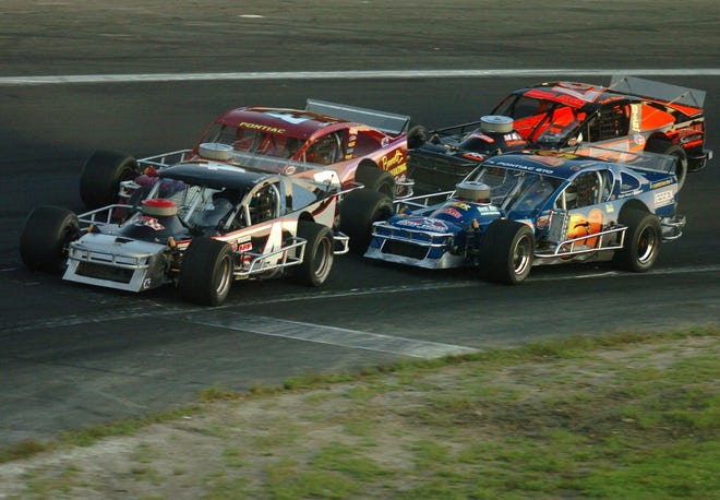 Ronald Yuhas Jr. of Groton, front, leads Saturday as Robert Janovic Jr. of Waterford, bottom right, begins to overtake Dennis Gada of Salem, back left, during their SK Modified feature race at the Waterford Speedbowl. Yuhas won the race.