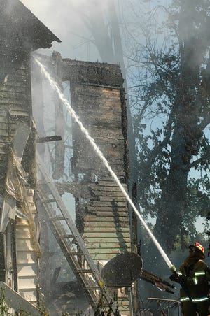 Area firefighters put out a blaze at a house off of AYP Road in rural Freeport on August 18, 2008.