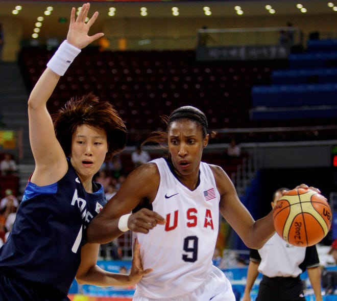 USA's Lisa Leslie drives to the basket against South Korea's KIm Jungeun during women's quarterfinal basketball game in Beijing on Tuesday.