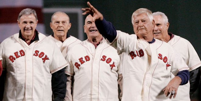 Hall of Famer Carl Yastrzemski, the last player to hit for the Triple Crown, was resting comfortably last night after having triple bypass heart surgery. He's shown here throwing out a ceremonial first pitch at Fenway Park with fellow members of the 1967 "Impossible Dream" team.