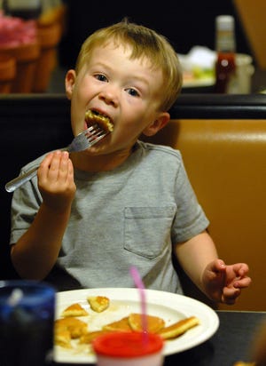Oscar Waters, 3, of Wayland enjoys some pancakes at Mel's Commonwealth Cafe.