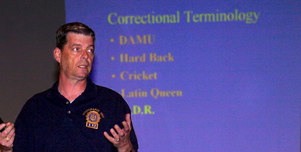 William Sheridan, gang intel officer of Rikers Island, speaks to law enforcement and correctional facility personnel during the Gang Task Force event at Stroudsburg Junior High School on Tuesday.