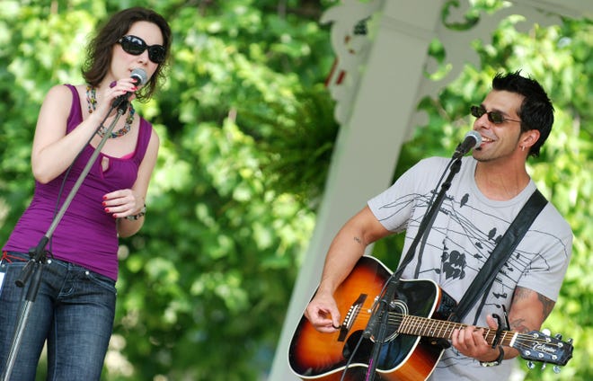 Lisa Romano, left, and Rocco Graziano perform in the gazebo on the village green during the Clinton Art and Music Festival, Saturday, August 23, 2008, in Clinton.