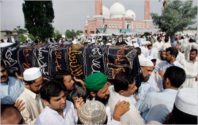 Mourners on Friday carried the coffin of a victim of Thursday’s suicide bombing in Wah, Pakistan.
