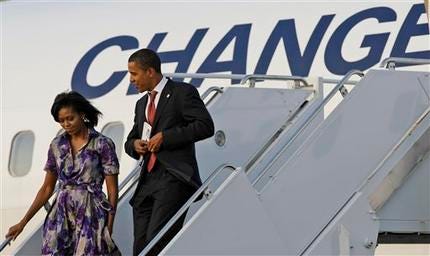 In this Saturday, Aug. 23, 2008 file photo, Democratic presidential candidate Sen. Barack Obama, D-Ill., walks off the plane with his wife Michelle Obama in Chicago, Ill.