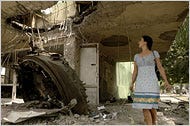 A tank turret lies inside a building where it was hurled during fighting this month in Tskhinvali, South Ossetia’s capital.