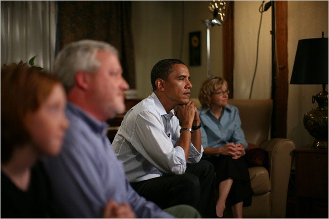 Senator Barack Obama took in his wife’s speech from Kansas City, Mo., watching on television with a family in the Midtown section: Bill and Alicia Girardeau and their daughter, Grace.