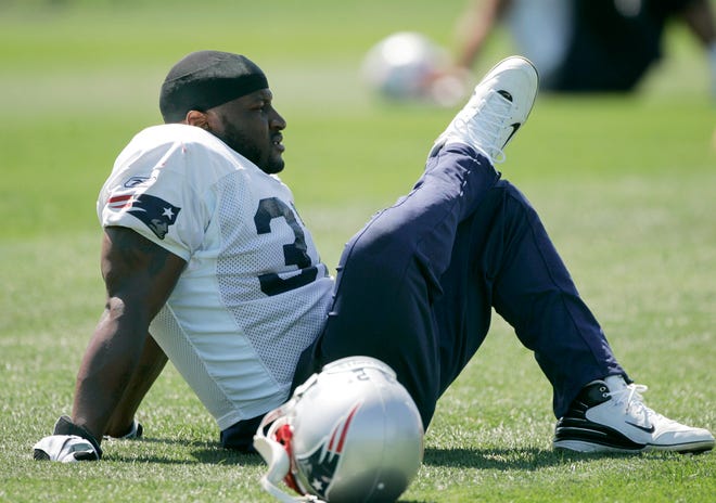 LaMont Jordan, one of five running backs competing for a spot on the Patriots roster, stretches before practice Tuesday in Foxboro.