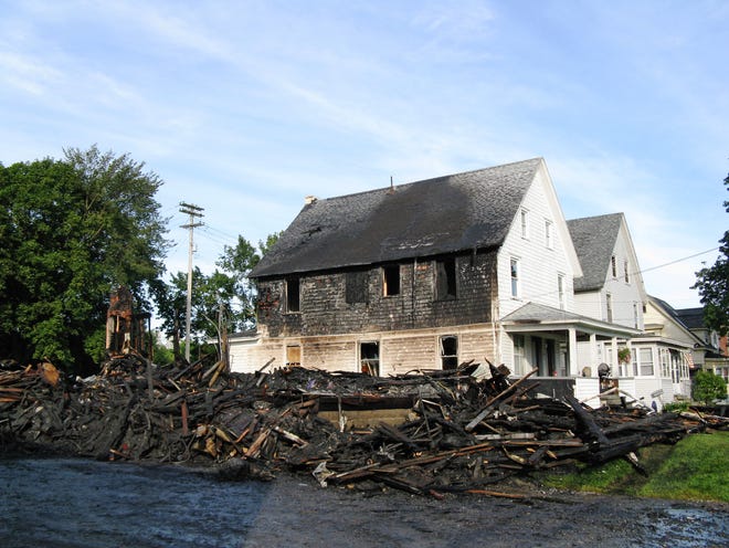 The remains of a home at 4356 Acme Rd. in Frankfort that collapsed just 20 minutes after firefighters arrived at 2:26 a.m. Wednesday, Aug. 27, 2008. Residents got out safely, but their home was a total loss, fire officials said.
