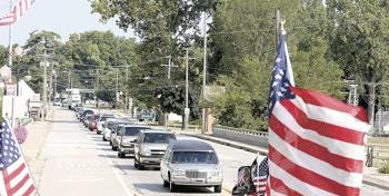 A procession of about 70 motorcycles and 20 vehicles carrying friends and family brought the body of Army Staff Sgt. Kristopher D. Rodgers home Wednesday morning. Rodgers, an American hero, was killed Aug. 16 in Korengal Valley, Afghanistan.