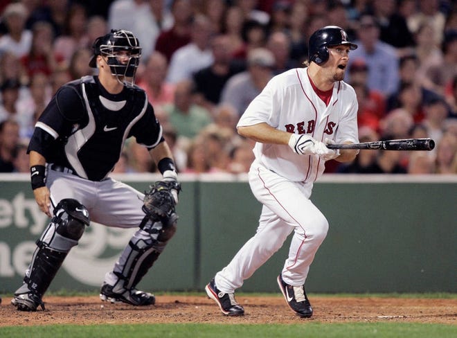 The Red Sox’s Mark Kotsay hits an RBI double in the fifth inning as Chicago’s A.J. Pierzynski looks on.