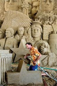 CHIEFTAIN PHOTO/JOHN JAQUES Sand sculptor Bob Bogle of Hawaii works on the sand sculpture titled ‘Liberty,” which is on display at the Colorado State Fair.