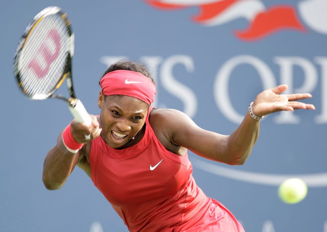 Serena Williams returns a shot during yesterday's match with Ai Suriyama at the U.S. Open.