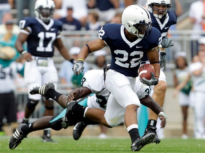 Penn State Evan Royster (22) runs for a first down as Coastal Carolina 
defender Chris Walls (38) dives to tackle him during the first half 
Saturday at Beaver Stadium in State College, Pa. Penn State won 66-10. Evan 
Royster ran for three touchdowns and 64 yards.