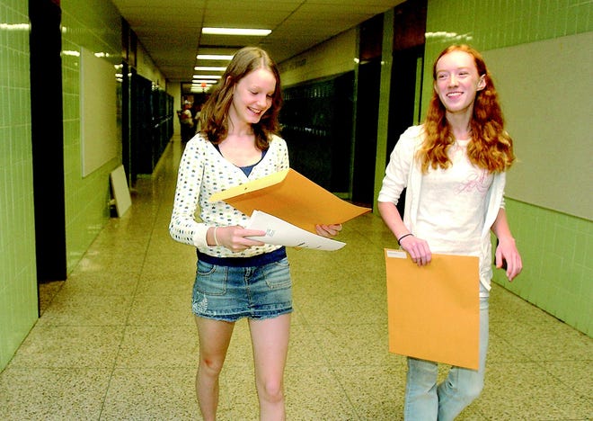 Hannah Schneeberger, left, and Hadley Strelau find their way to their lockers during freshmen orientation last week at Webster Schroeder High School.