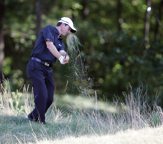 Mike Weir shoots out of the rough on the ninth hole Monday at the Deutsche Bank Championship.