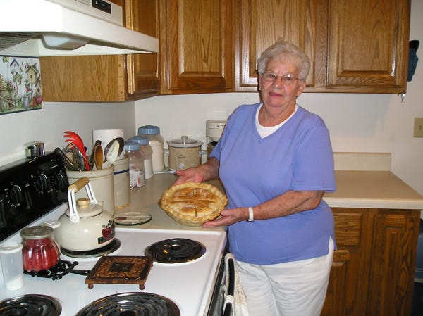 Lee VanHerzeele takes a homemade pie out of the oven.