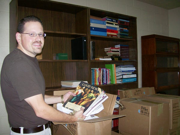 The Rev. Christopher Bushre moves into his new office at St. John’s Lutheran Church in rural Geneseo.
