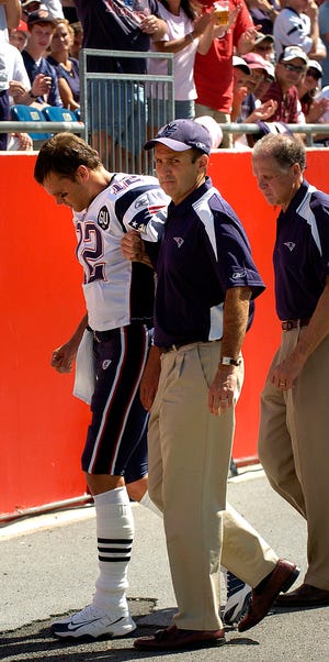 Patriots quarterback Tom Brady is helped off the field after injuring his knee in the season opener against the Kansas City Chiefs at Gillette Stadium in Foxboro.