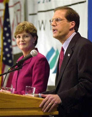 In this Oct. 14, 2002, file photo Democratic Gov. Jeanne Shaheen, left, listens to her Republican rival U.S. Rep. John Sununu, during a televised debate for New Hampshire's U.S. Senate race at Saint Anselm College in Goffstown, N.H. In what is anticipated to be another tight 2008 U.S. Senate race incumbent Sununu is in a rematch against Shaheen in New Hampshire, a state that is famously independent and unpredictable. (AP Photo/Jim Cole, File)