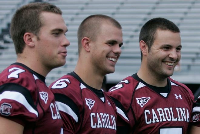 South Carolina quarterbacks Chris Smelley, left and Tommy Beecher, center, are both likely to see action this week against No. 2 Georgia. Redshirt freshman Stephen Garcia, right, isn't quite ready but is closing fast, according to coach Steve Spurrier.