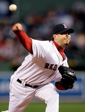 AP Photo
Boston Red Sox starting pitcher Josh Beckett delivers to the Tampa Bay Rays during the first inning of their game at Fenway Park in Boston Wednesday.