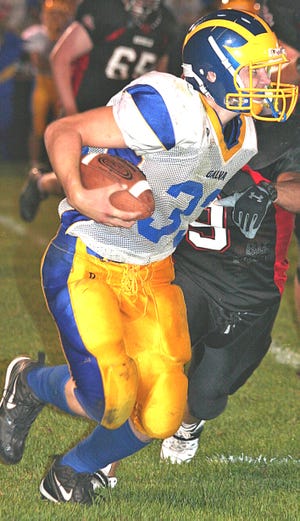 Galva’s Bryce Glisan tries to get around a Stark County Rebel during the Sept. 5 game in Wyoming. The host Rebels pitched their second straight shutout, blanking the Wildcats 55-0.