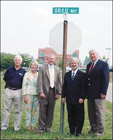 Oak Ridge Mayor Tom Beehan, far right, officially dedicated ORAU Way at the corner of Badger Avenue on Sept. 9. With Beehan at the sign unveiling were, from left, Oak Ridge City Manager Jim O'Connor, Oak Ridge Director of Community Development Kathryn Baldwin, ORAU President Ron Townsend and U.S. Department of Energy Oak Ridge Office Manager Gerald Boyd.