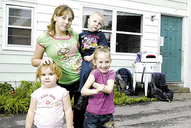 When a bad chemical reaction filled her apartment with toxic fumes, 14-year-old Katrina Loucks carried Savannah O'Connor, 3, left, and her siblings, Corin Schulhoff, 6, and Everett Loucks, 3, to safety.