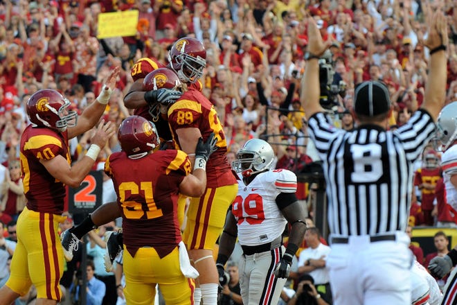LOS ANGELES, CA - SEPTEMBER 13: Blake Ayles #89 of the USC Trojans and teammates react after Ayles scored a 1-yard touchdown catch in the second quarter against the Ohio State Buckeyes during the college football game at the Los Angeles Memorial Coliseum on September 13, 2008 in Los Angeles, California. (Photo by Harry How/Getty Images)