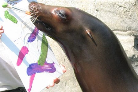 Sushi, a sea lion at the Audubon Zoo in New Orleans, wields her paint brush. Paintings such as this one are to be auctioned online today.