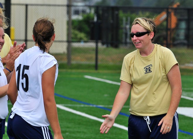 Christine McCarey of Middleboro, right, is head coach of the Mass. Maritime women's soccer team and is building it from scratch in its first year of existence. McCarey is also the Mass. Maritime softball coach.