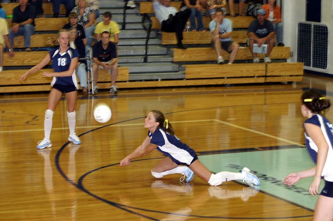 Prairie Central’s Jamie McKeon dives to bump the ball for the Hawks during Tuesday’s Corn Belt Conference match with Mahomet-Seymour. Looking on for the Hawks is Abby Popejoy.