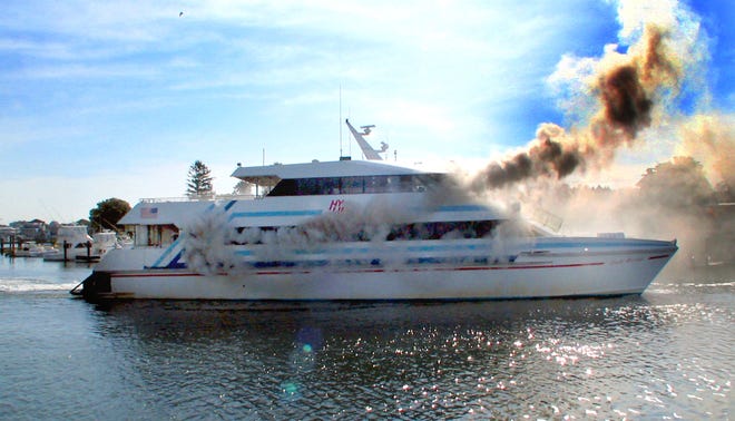 Smoke billows from the Lady Martha as it attempts to make it was to a dock in Hyannis Harbor Thursday morning.