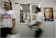 Supporters of Tzipi Livni worked Tuesday amid posters bearing her likeness at her campaign headquarters in Netanya, Israel.