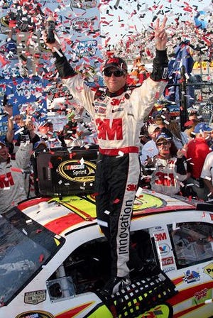 AP Photo
Greg Biffle celebrates in victory lane after winning the NASCAR Camping World RV 400 Sprint Cup Series race at Dover International Speedway in Dover, Del. Sunday.
