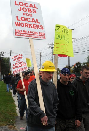I.B.E.W. Local 103 workers picketing Genzyme along New York Avenue Monday morning.