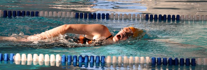 Making waves: The Washington girls swimming team opened its home schedule at the Five Points Washington Aquatic Center with a convincing victory Thursday over Olympia, 125-48. Freshman Lauren Dwyer, pictured, competes in the 500 freestyle.