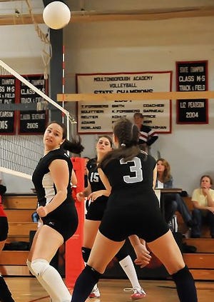 RAY MONGEAU/CITIZEN PHOTO 

Prospect Moutain's Melissa Fortin, foreground, gets ready to set up a return against Moultonbourgh.