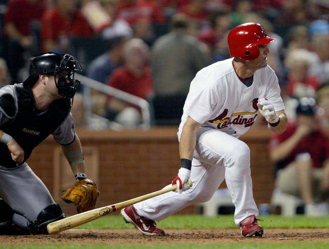 The Cardinals’ Adam Kennedy drives in a run on an RBI single during the fifth inning.