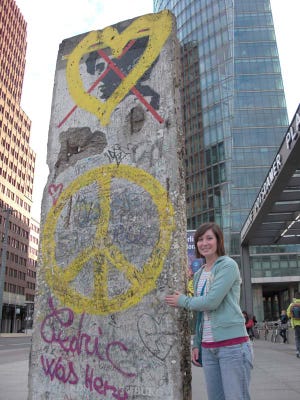 Cassie Bowen stands next to a portion of the Berlin Wall on her recent trip to Germany where she visited four foreign exchange friends.