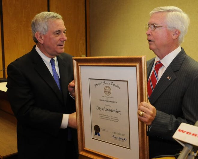 State Treasurer Converse Chellis, right, presents the state's first Award for Financial Excellence
 to Spartanburg Mayor Bill Barnet.