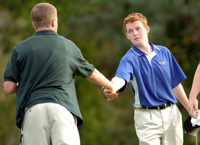 Abington's #1 player Corey Donlan and Norwell's #1 player Kris McIntosh shake after their round at Strawberry Valley Golf Course. McIntosh shot a 1- over par 35 to win the match.