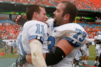 North Carolina quarterback Cameron Sexton (11) is hugged by Aaron Stahl after Sexton threw the game-winning touchdown to Brooks Foster in the fourth quarter.