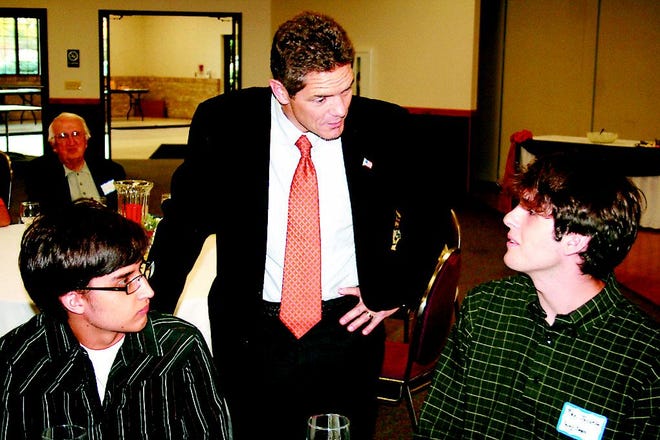 Schauer with young Democrats Andre Jonsson, left, and Max Jacobs.