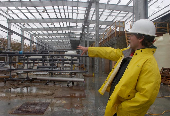 Ryan Byrnes of Raynham, Aquaria project engineer, gives a tour of the filtration system in Dighton in this 2007 file photo.