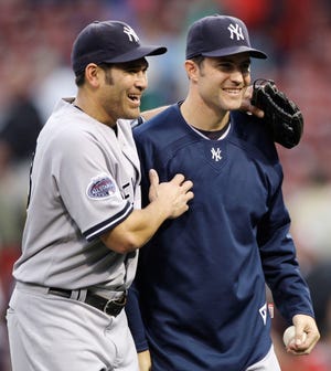 Mike Mussina, right, and Johnny Damon.