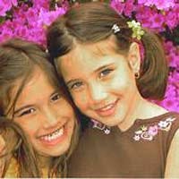 Roberta Lima believes her daughters Domminique, left, and Pietra, right, were abducted by their father and taken to Brazil.