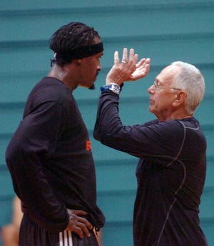 Bobcats head coach Larry Brown works with player Gerald Wallace at the team's training camp Tuesday at Trask Coliseum. Brown is in his first year as Bobcats' head coach.Staff photo | Mike Spencer