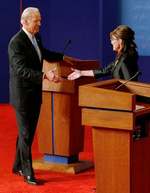 Republican vice presidential candidate, Alaska Gov. Sarah Palin shakes hands with Democratic vice presidential candidate, Sen. Joe Biden, D-Del., after the vice presidential debate Thursday night at Washington University in St. Louis, Mo.